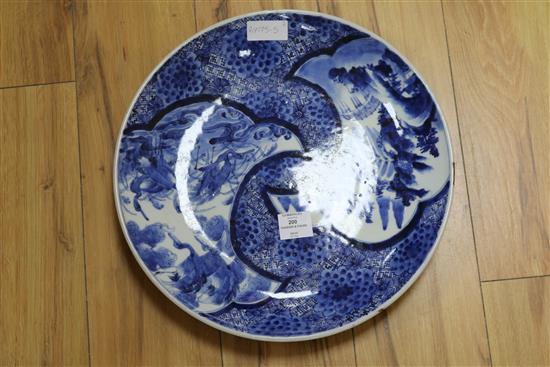 A Japanese Arita blue and white charger and a Chinese pottery figure charger diameter 40cm